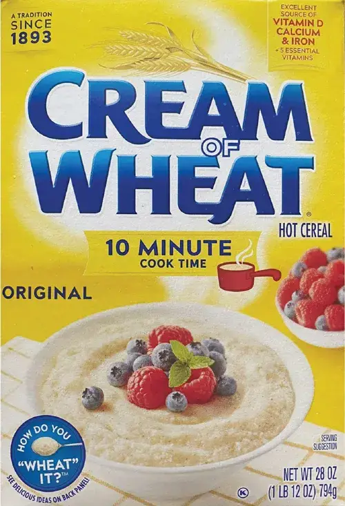 Cream of Wheat box with cooked cereal and berries.