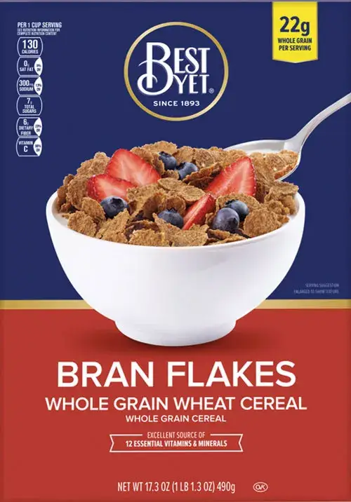 Bowl of bran flakes with strawberries and blueberries.