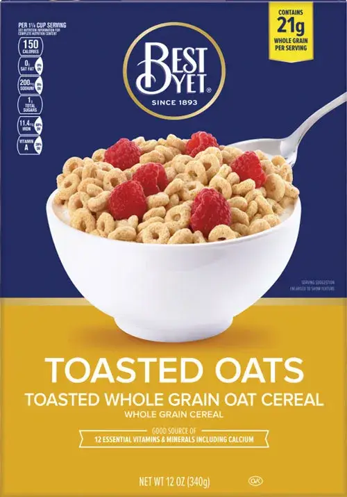 Cereal bowl with raspberries and spoon on box.