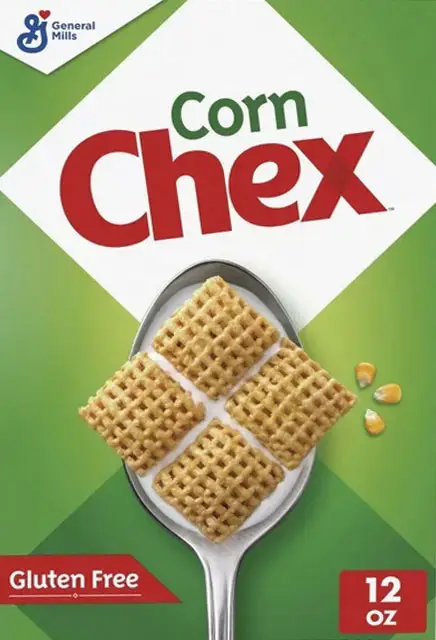 Corn Chex cereal on spoon with corn kernels.