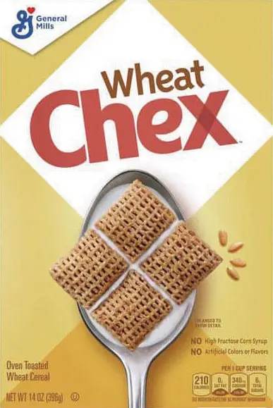 Spoonful of Wheat Chex cereal on yellow background.
