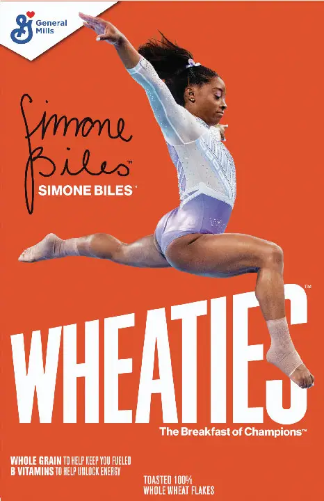 Gymnast performing leap on Wheaties cereal box.