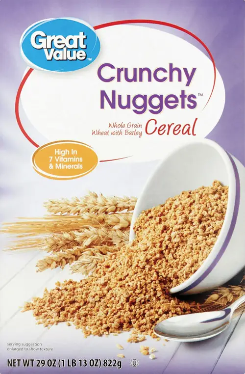 Crunchy cereal nuggets spill from white bowl.