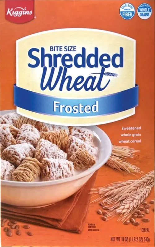 Box of frosted shredded wheat cereal on table.