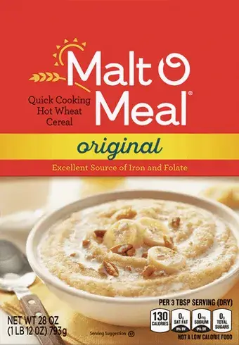 Malt-O-Meal cereal bowl with spoon, nuts, and bananas.