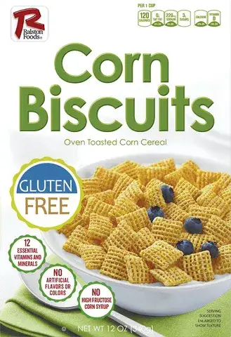 Corn biscuits cereal in bowl with blueberries, gluten-free.