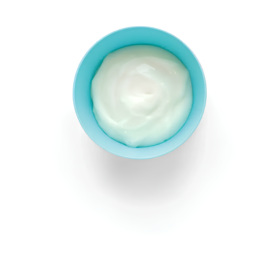 Blue bowl with creamy yogurt on white background.