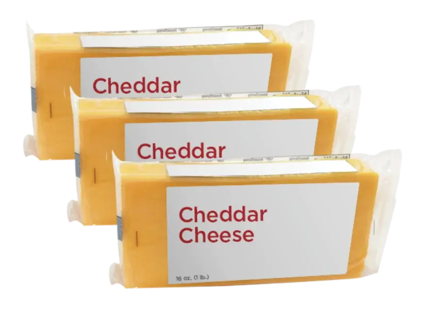 Three blocks of packaged cheddar cheese displayed.