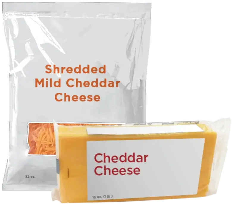 Shredded and block cheddar cheese in packaging.